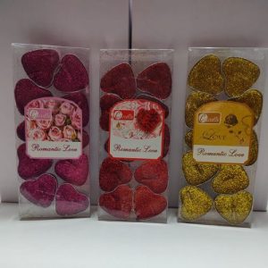 Velas en forma de corazòn con glitter